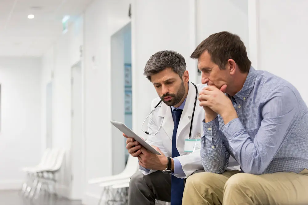 A clinician reviewing a treatment plan with a patient