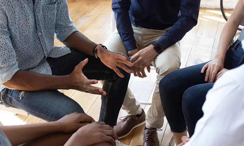 A group therapy session in close conversation