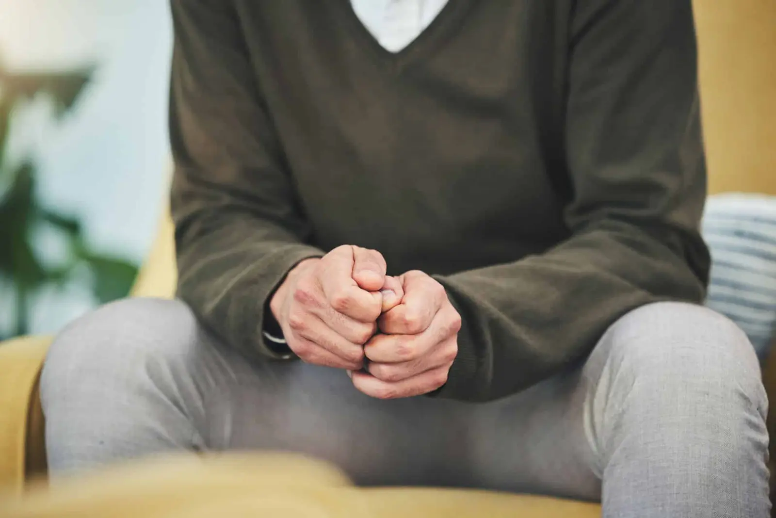 Man with clenched fists working through unresolved trauma