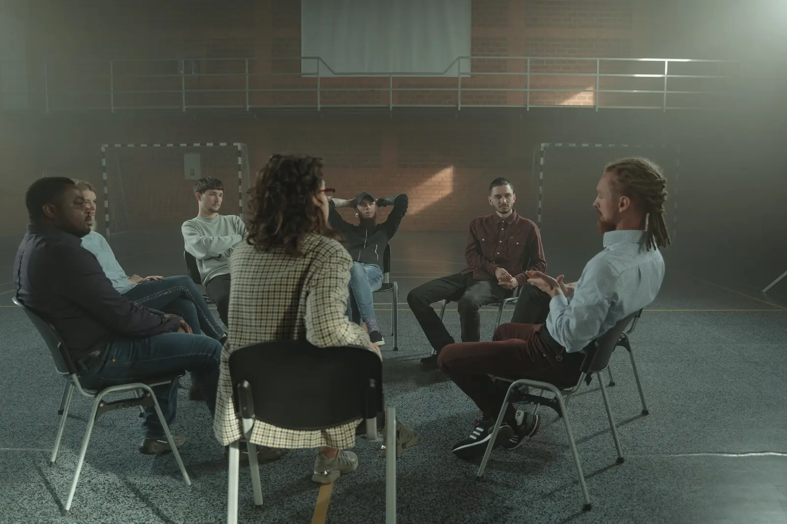 A group therapy session seated in a circle