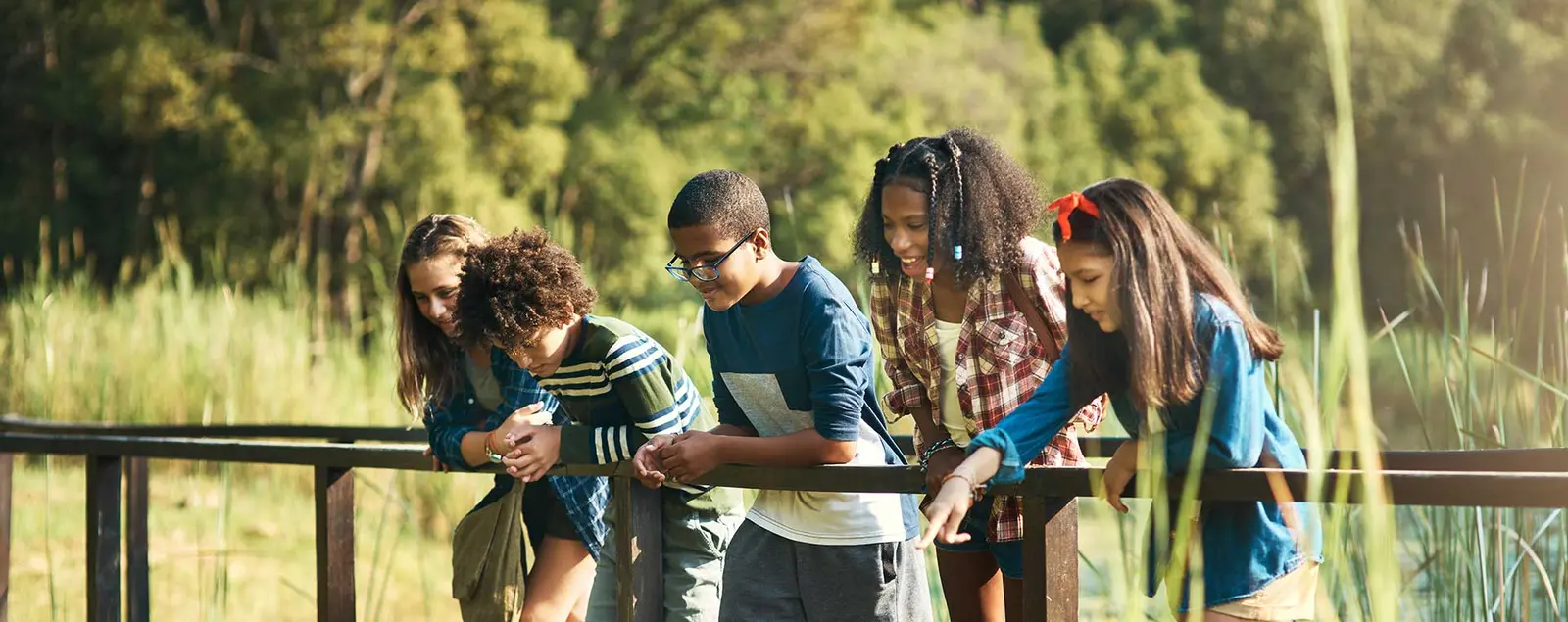 A group of teenagers talking together outdoors