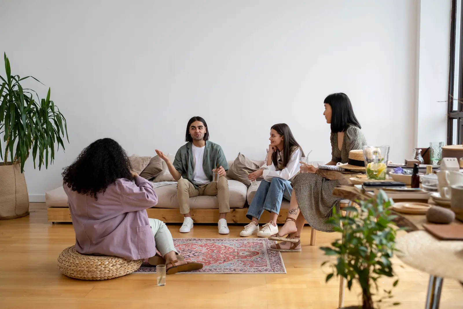 A small group in conversation in a comfortable living room