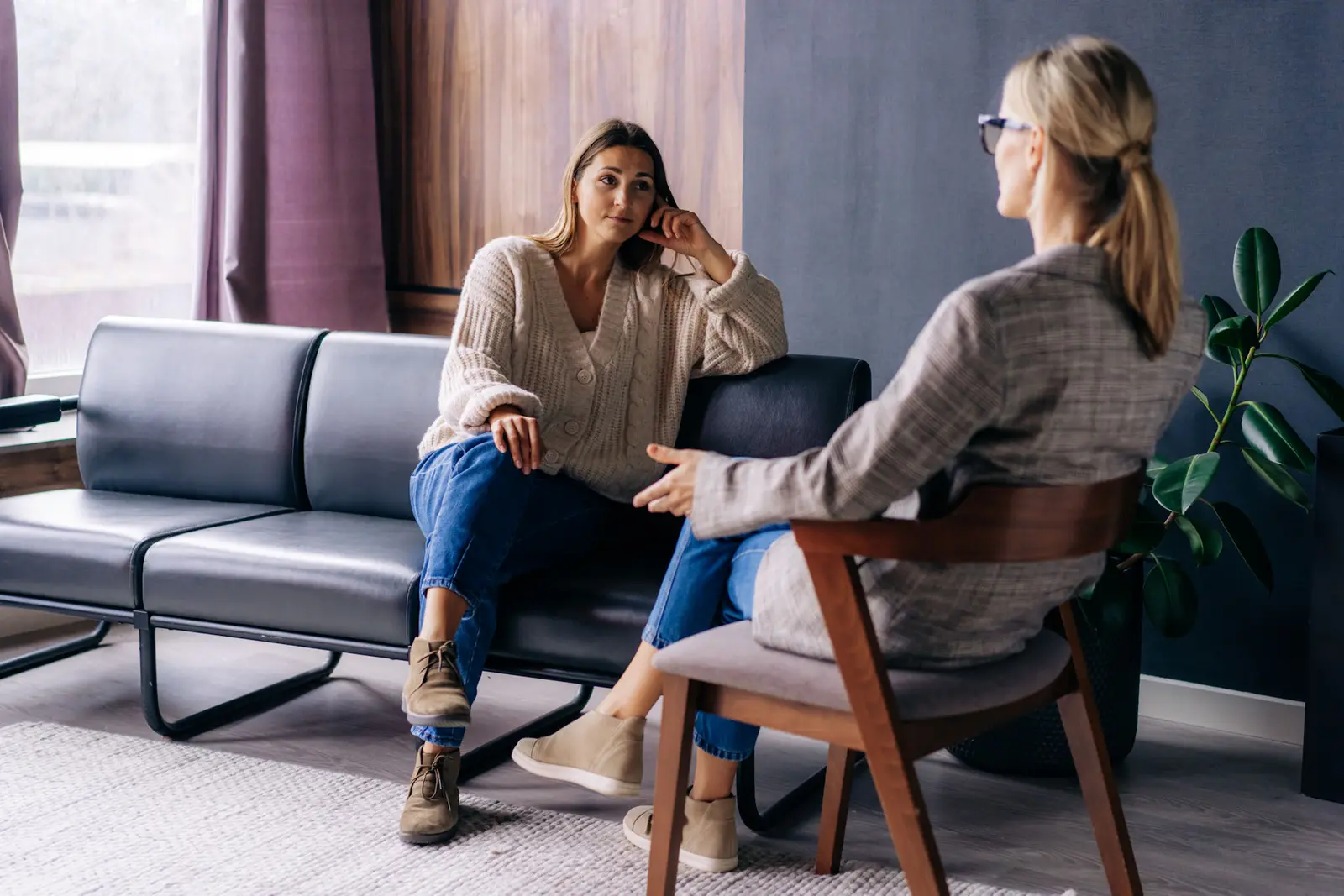 A woman talking one-on-one with her therapist