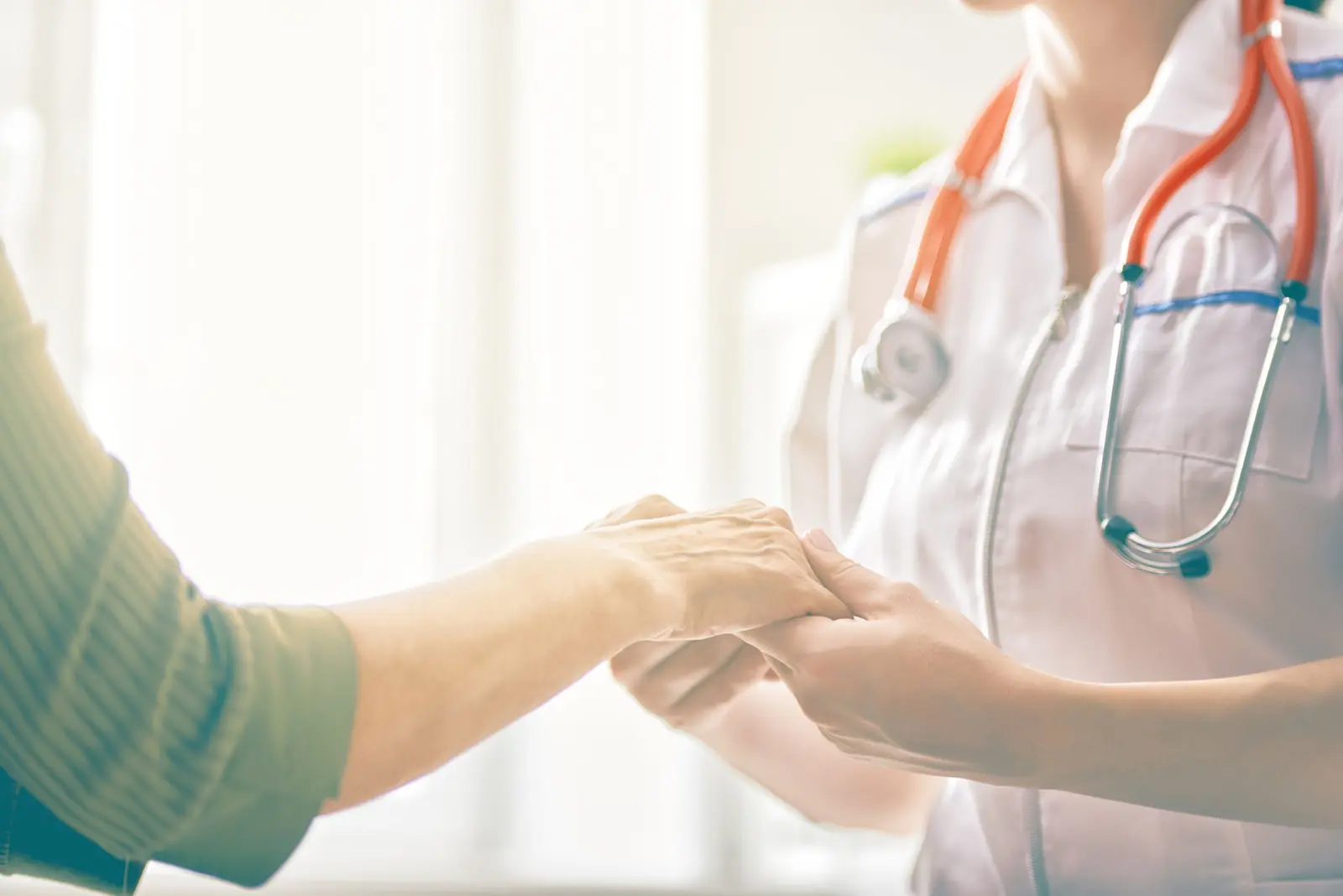 A clinician reassures a patient during a psychiatric consultation
