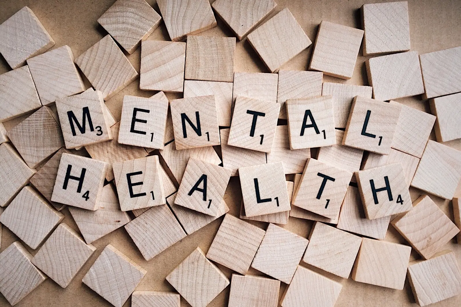 Letter tiles spelling out the words mental health