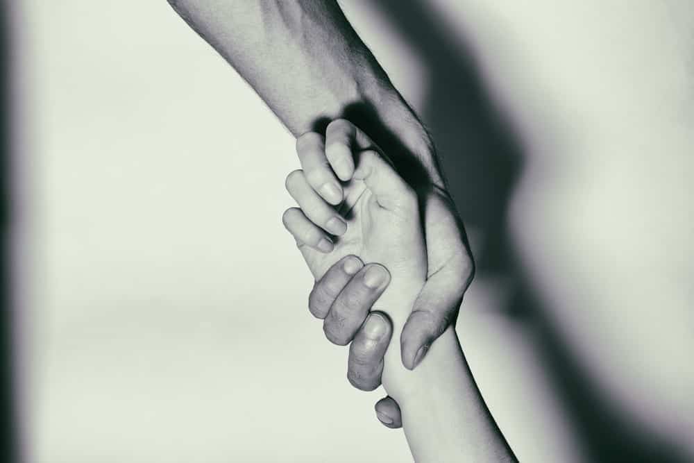 hands grabbing each other