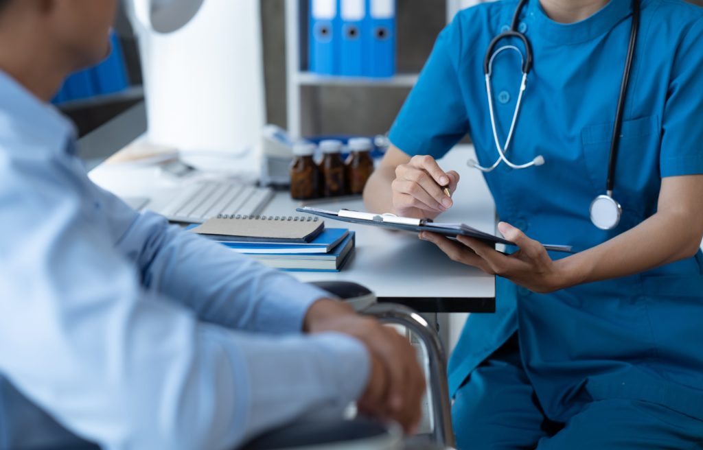 patient talks to doctor during opioid detox