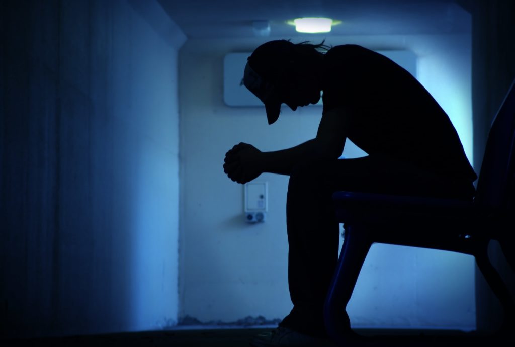 upset man struggles with cycle of addiction