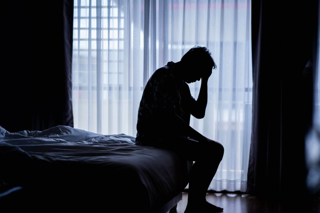 A man struggling with anxiety who would benefit from treatment through Ambrosia.